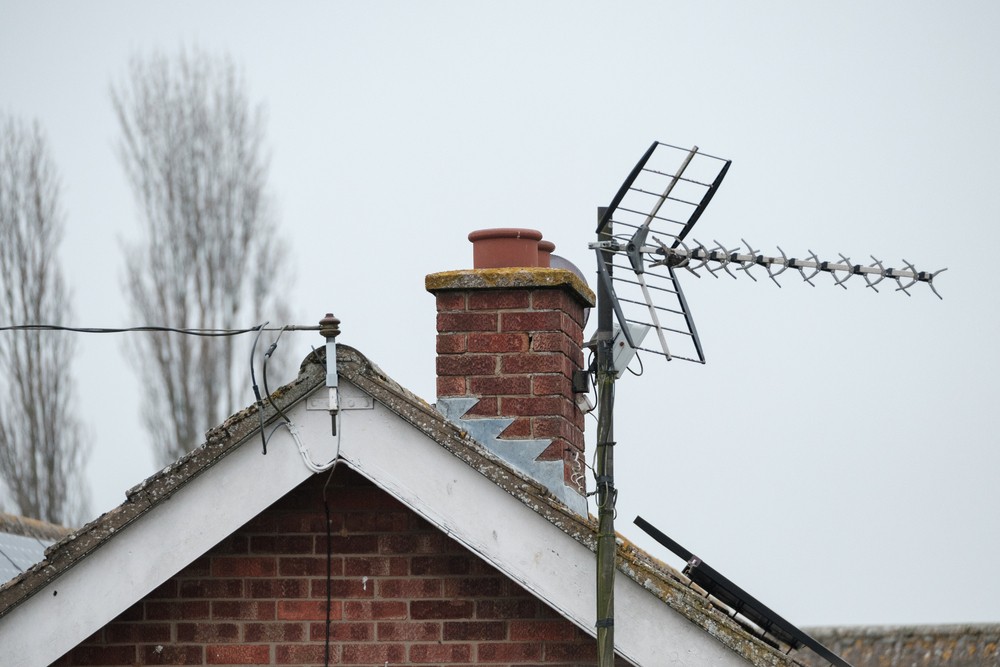 TV aerial on Brentwood roof top with chimney