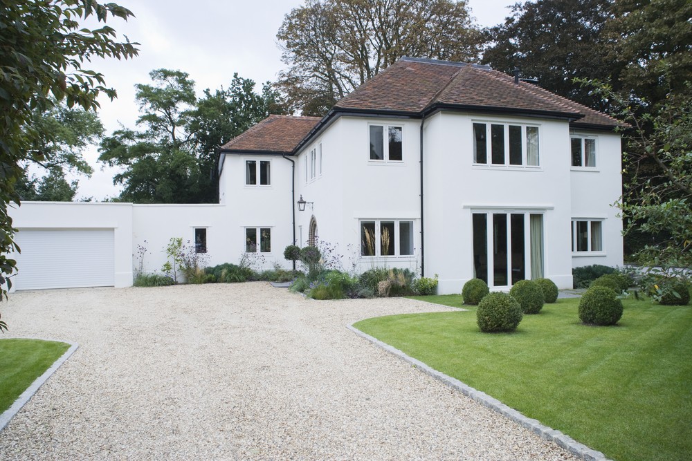 house exterior with surrounding yard and driveway